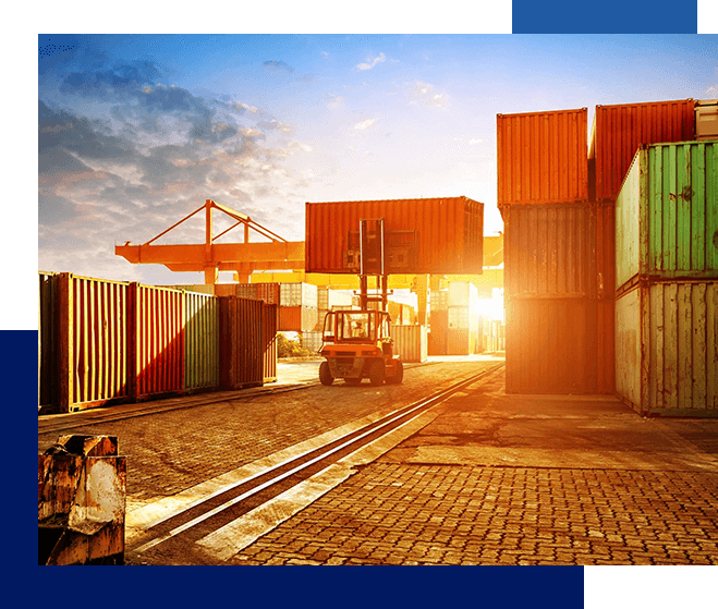 A sunset view of an industrial area with containers.